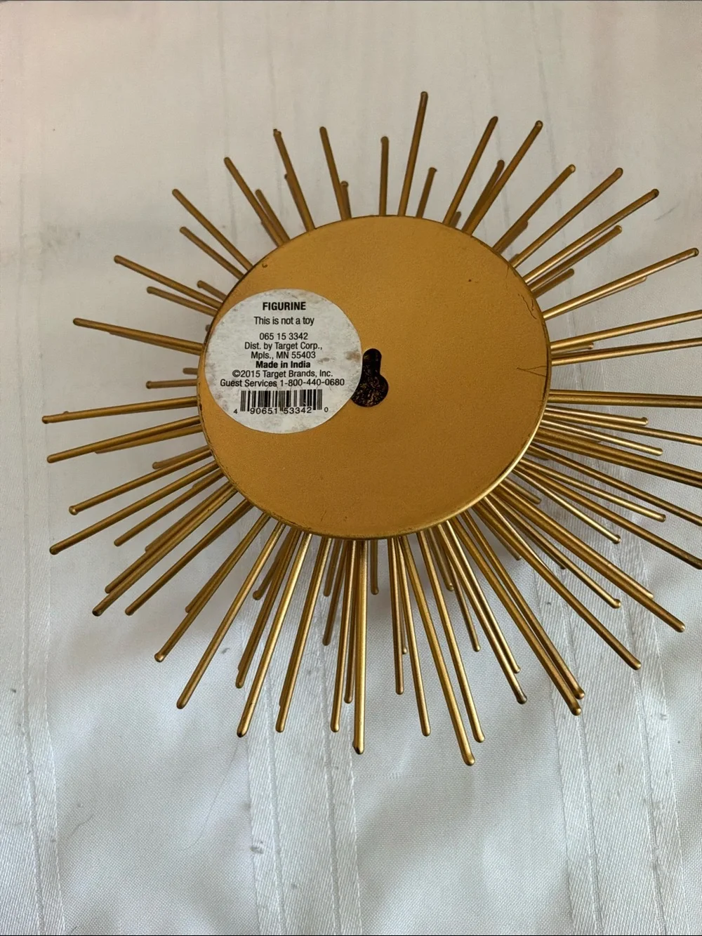 Gold tone metal atomic starburst or sea urchin wall art